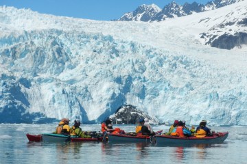 Kayakers near Aialik Glacier in Alaska