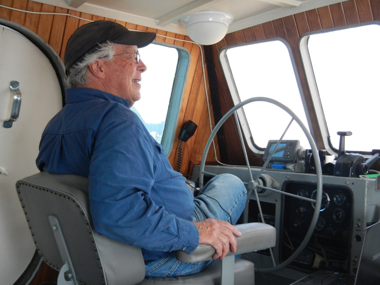Captain Mike Brittain on the bridge of his ship near Seward, AK