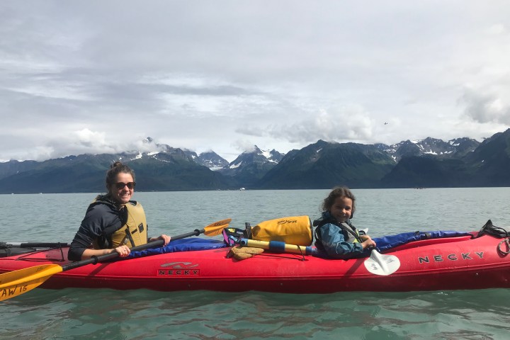 Mother and daughter sharing a double kayak on a private family half day kayak tour