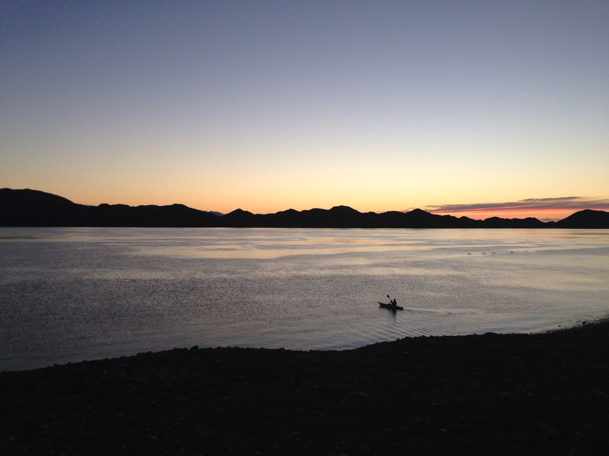 IMG_5383 a sunset over a body of water