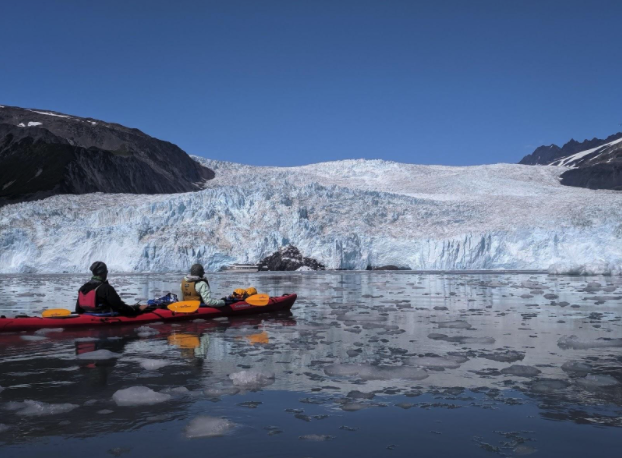 a group of people on a boat in the water